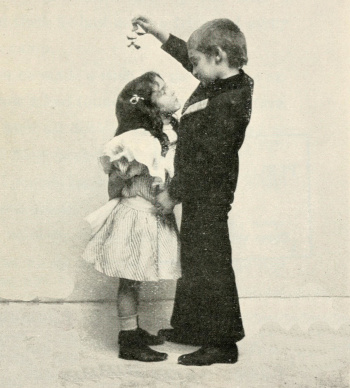 Children kissing under a mistletoe (1902)